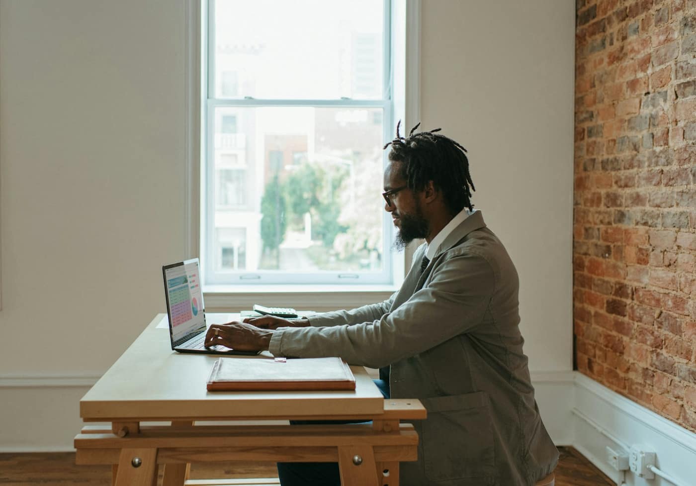 An Australian sole trader working at a desk