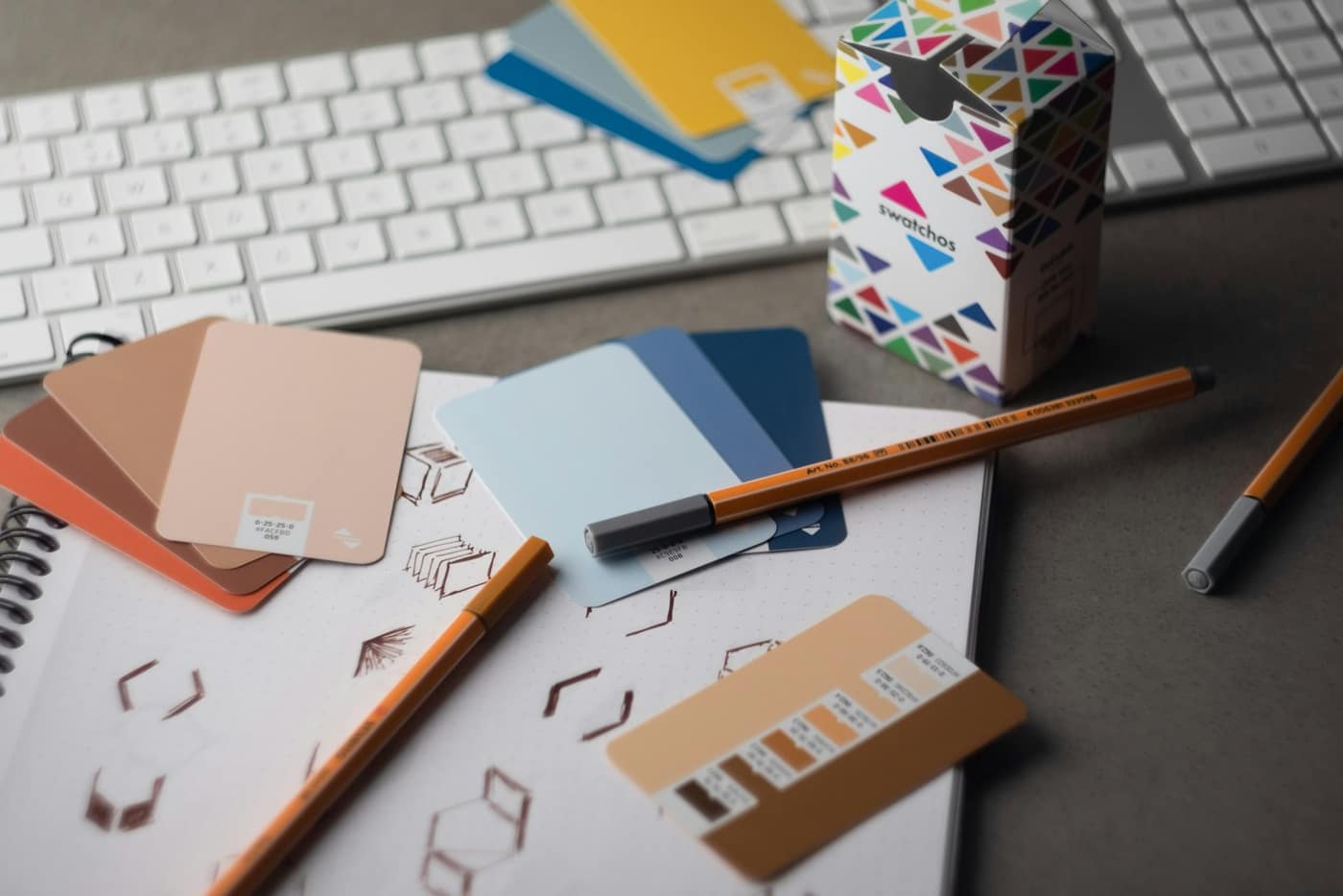Brand colour swatches on a desk
