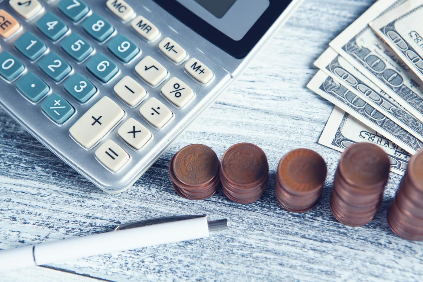 A calculator and notes for working out a deposit