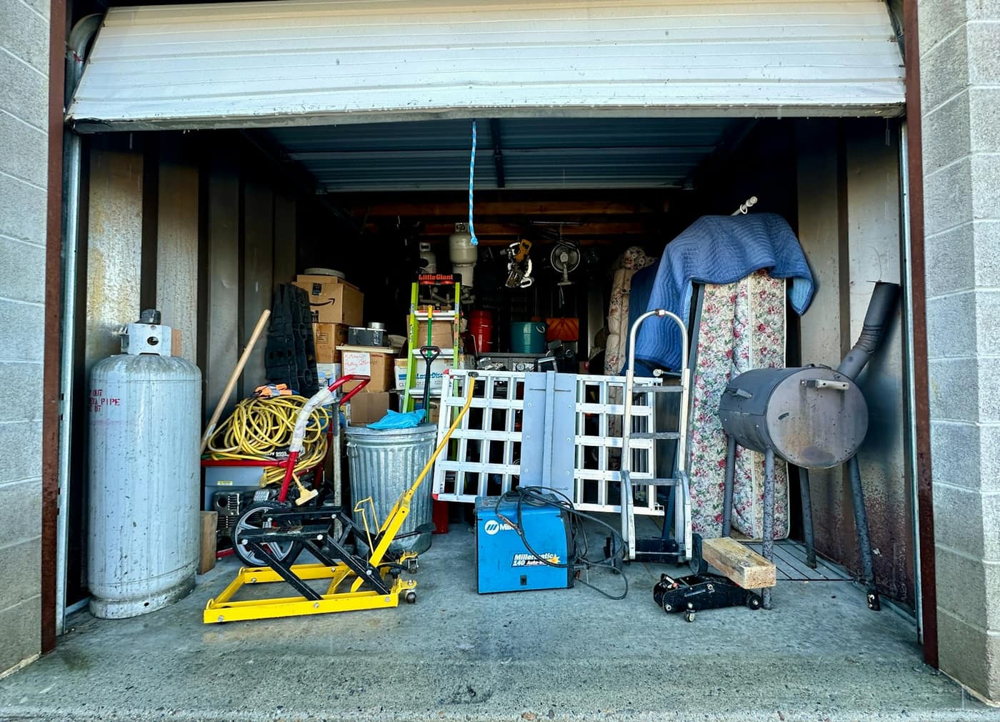 A cluttered garage needing a clear-out