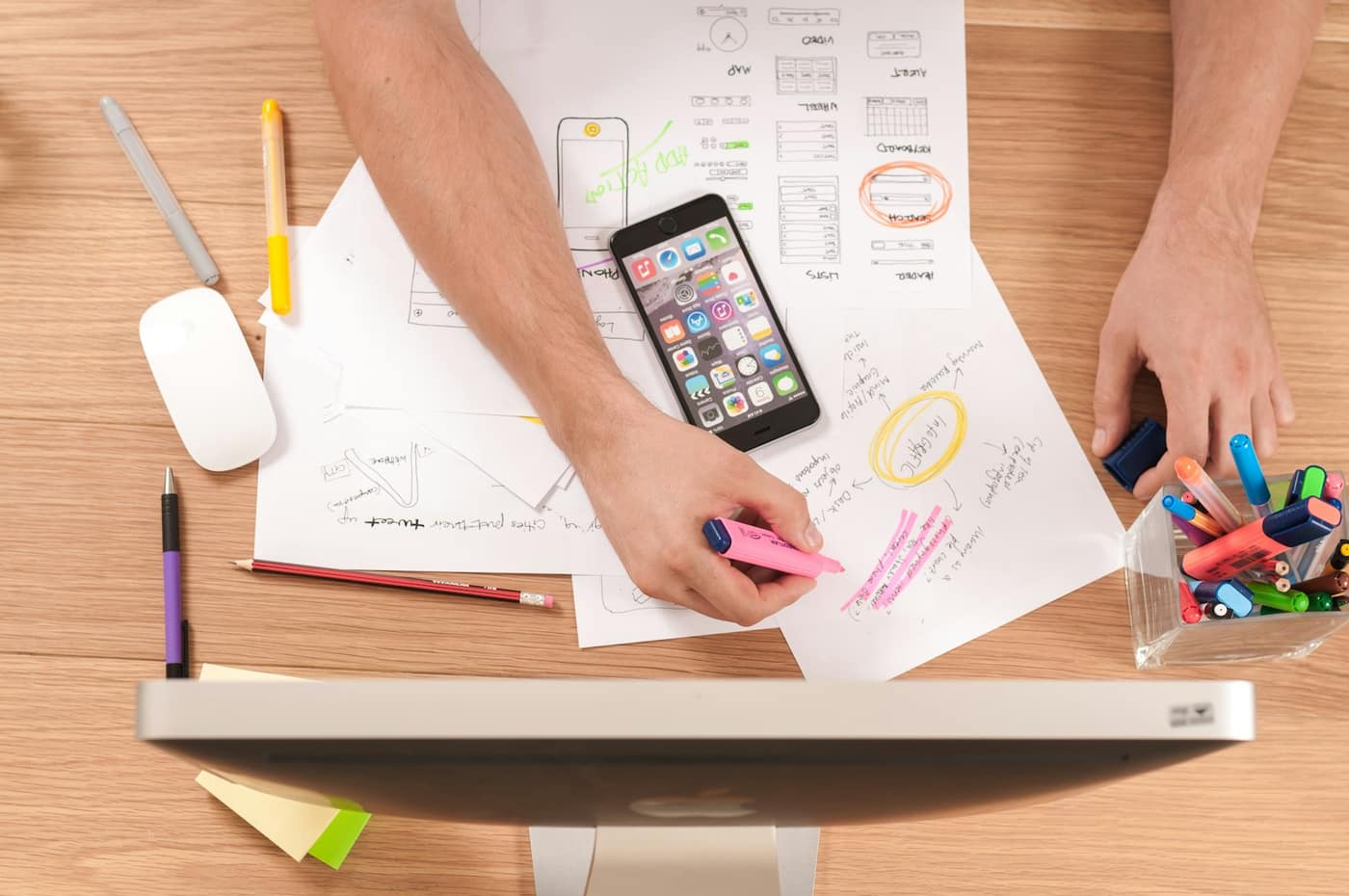 A content planning calendar and notes on a desk