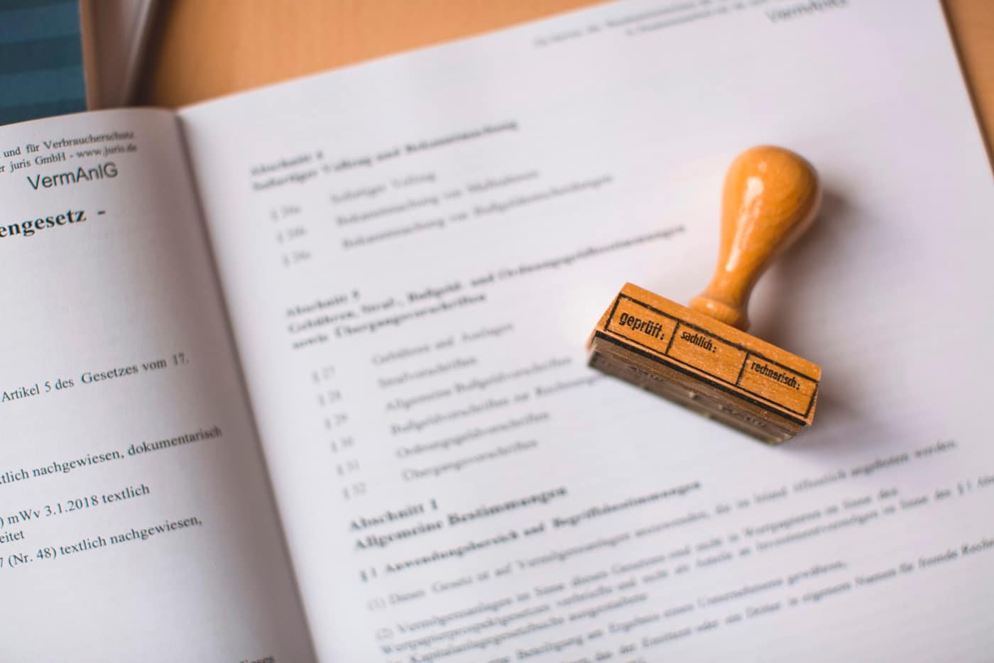 A stamp and paperwork on a desk