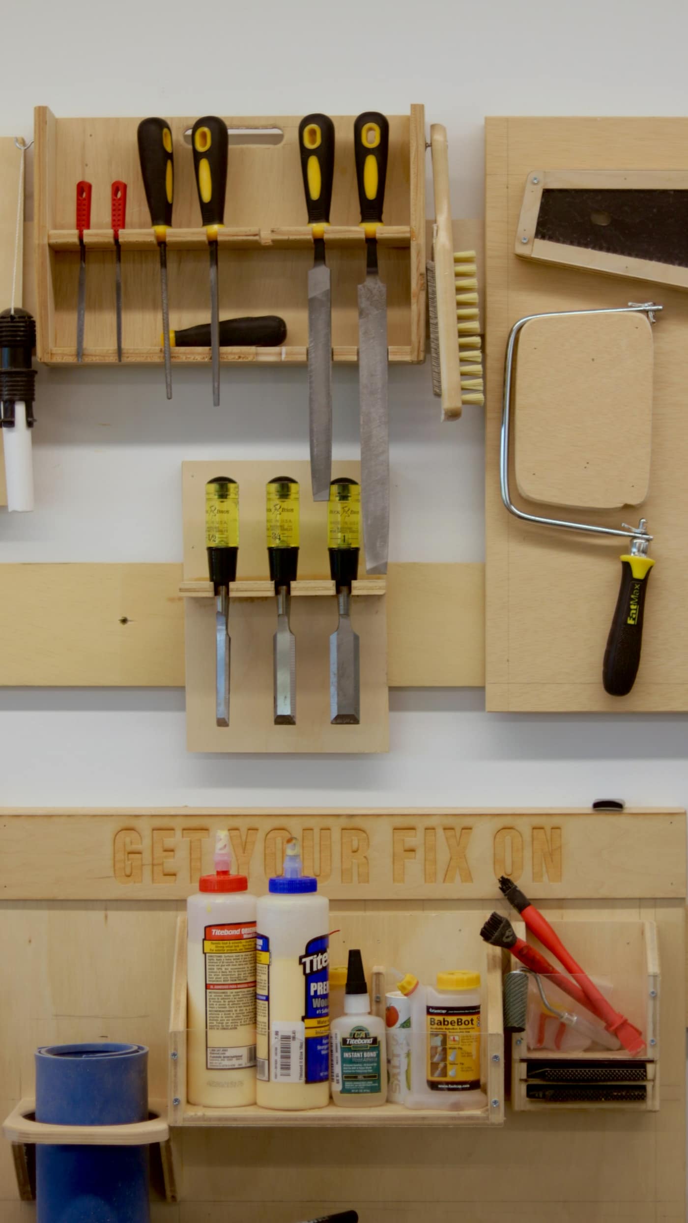 A handyman's tool belt and tools on a workbench