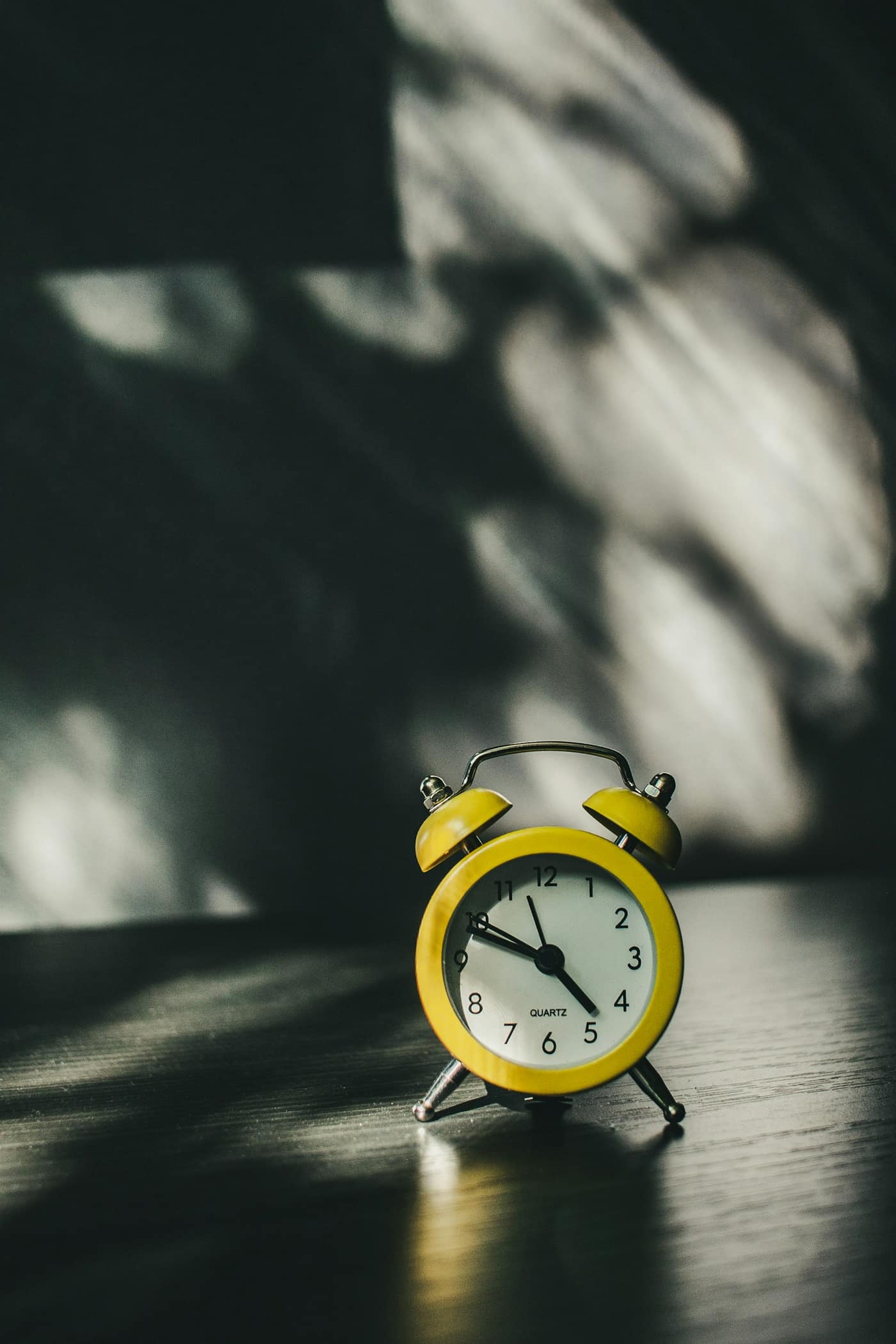 An alarm clock on a work desk