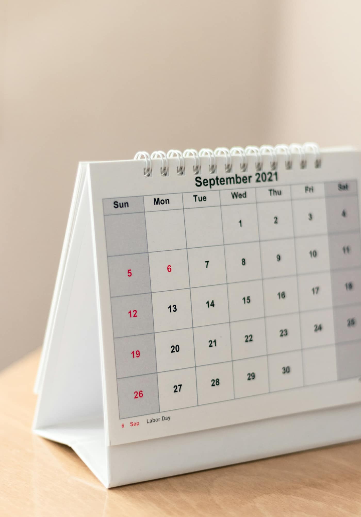 A desk calendar marking when to send an invoice