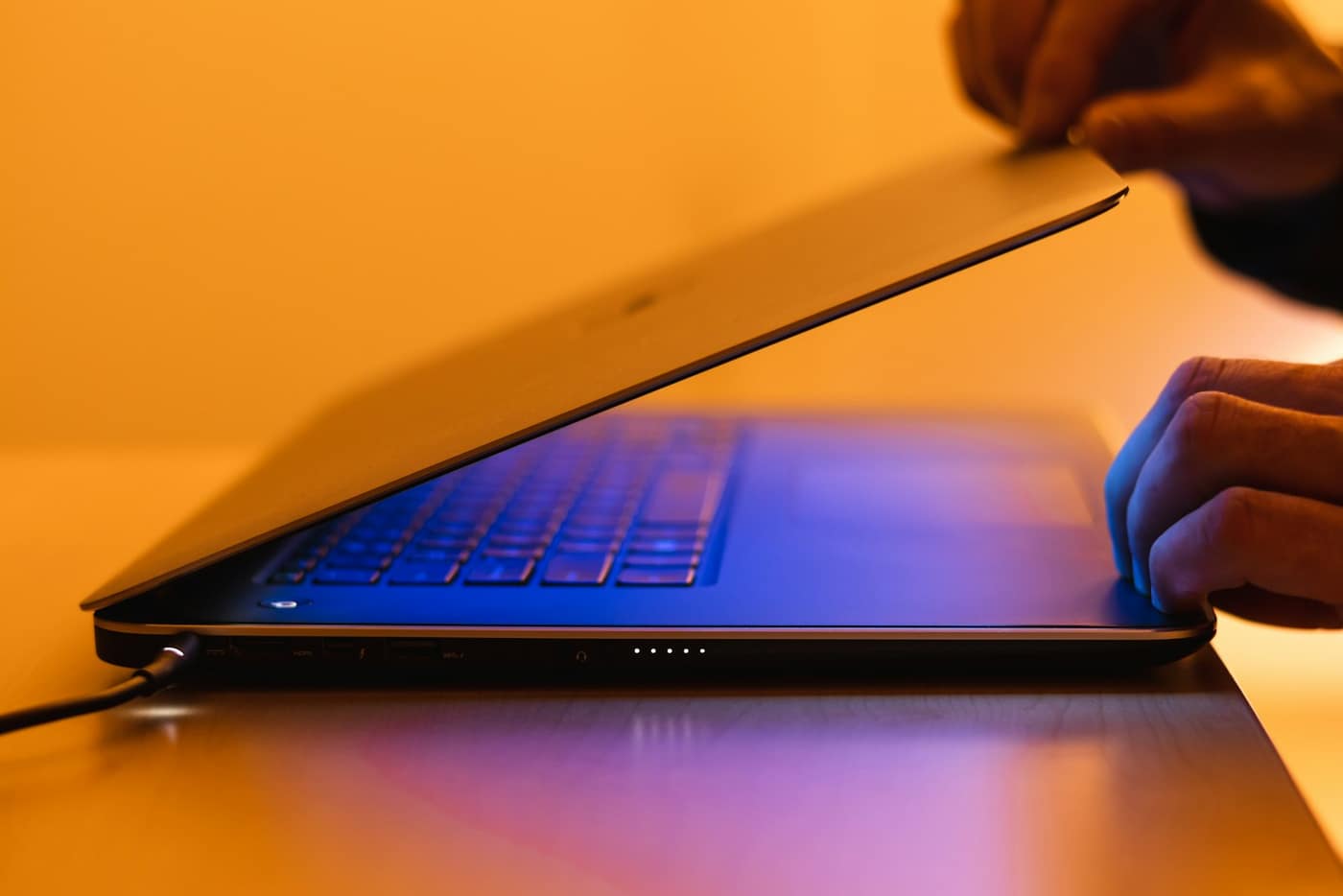 An IT professional working at a laptop