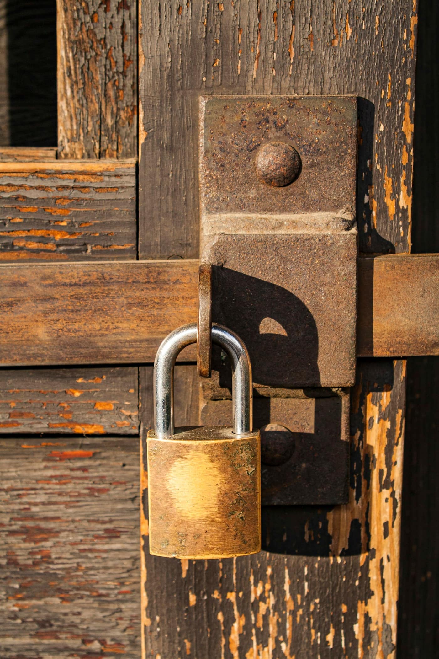A padlock on a wooden door