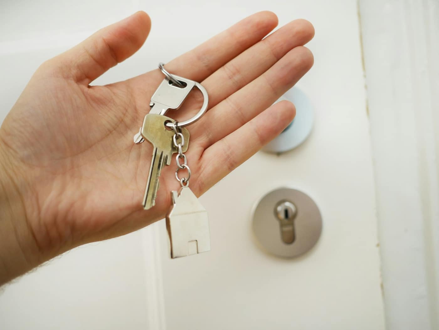 A set of keys held in a hand