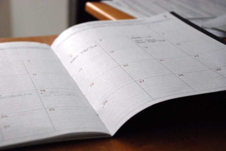 An open monthly planner on a wooden desk