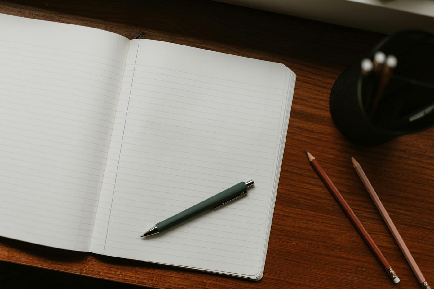 Invoice paperwork and a notebook on a desk