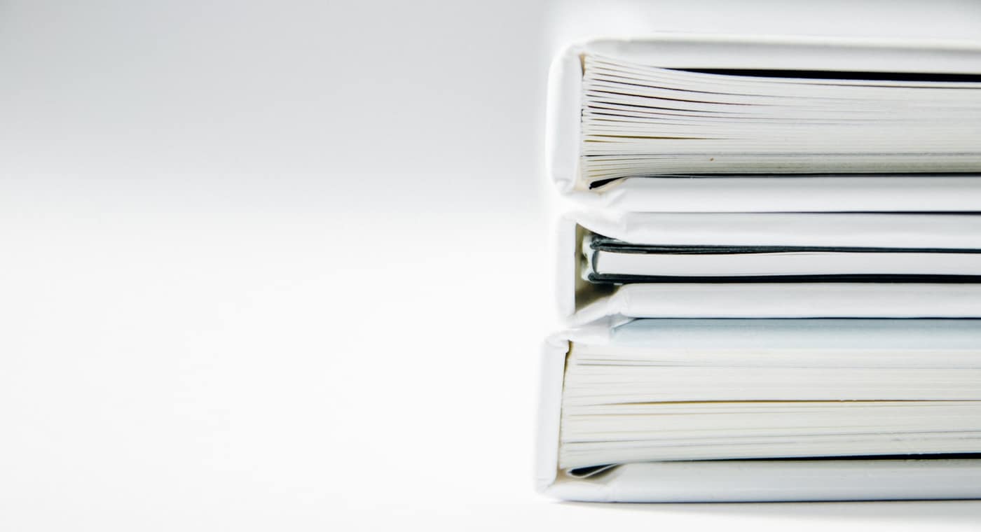 An office desk with paperwork folders