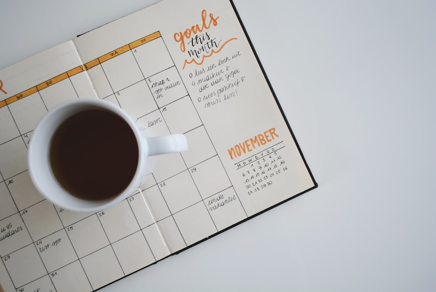 A coffee mug resting on top of an open planner