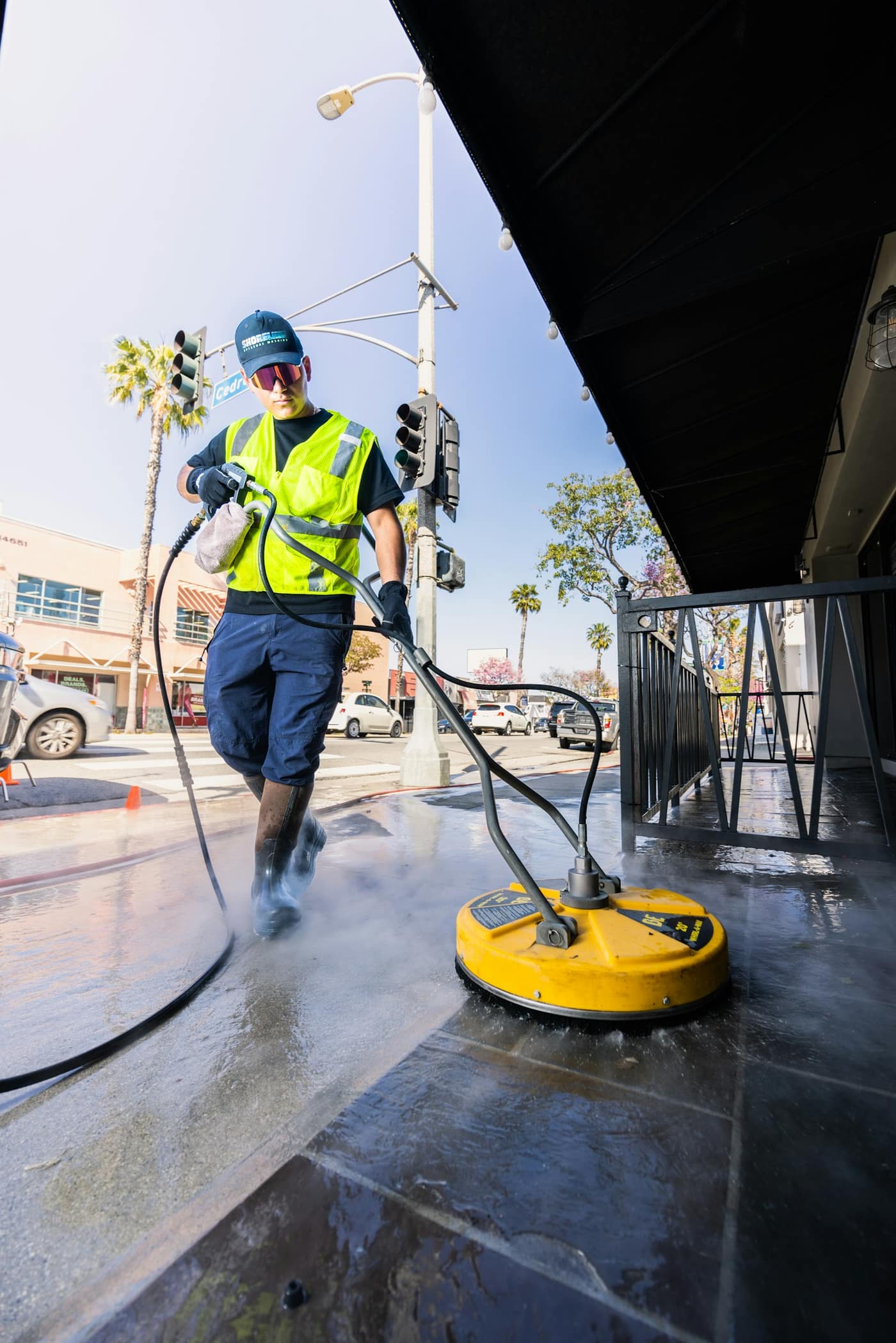 Cleaning a paved surface with water