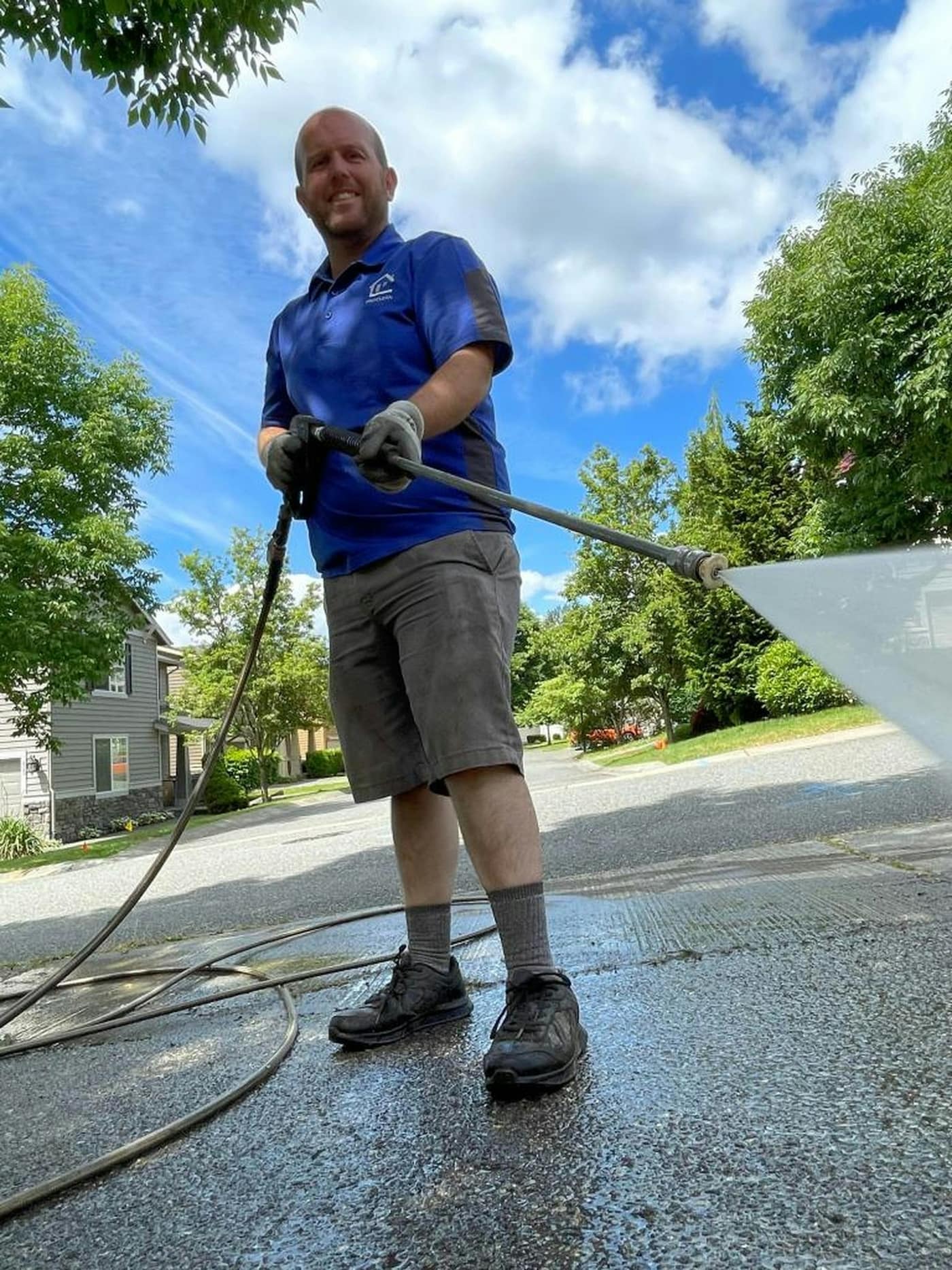 A driveway being pressure washed clean