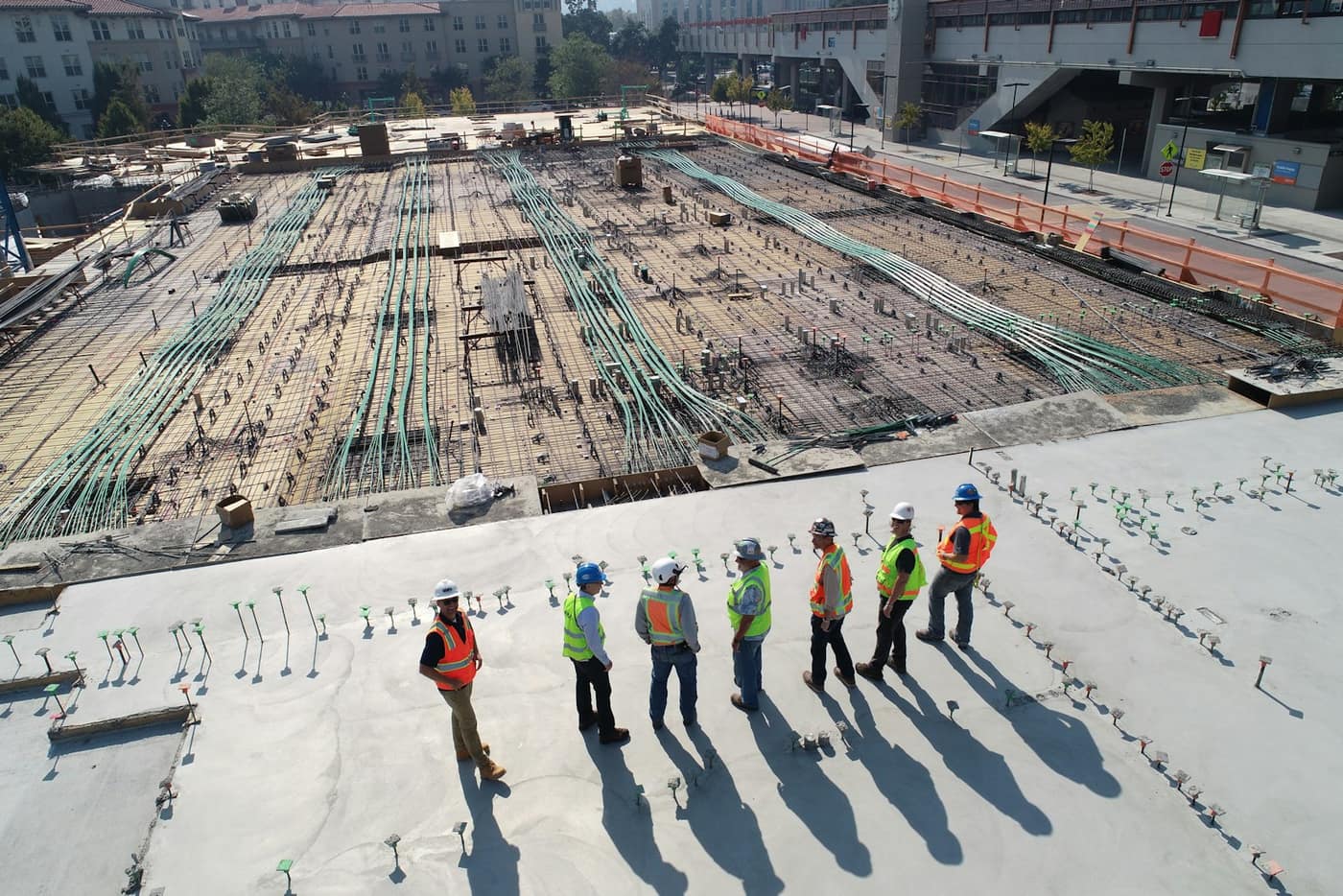 A construction site part way through, with rebar laid out ready for a concrete slab