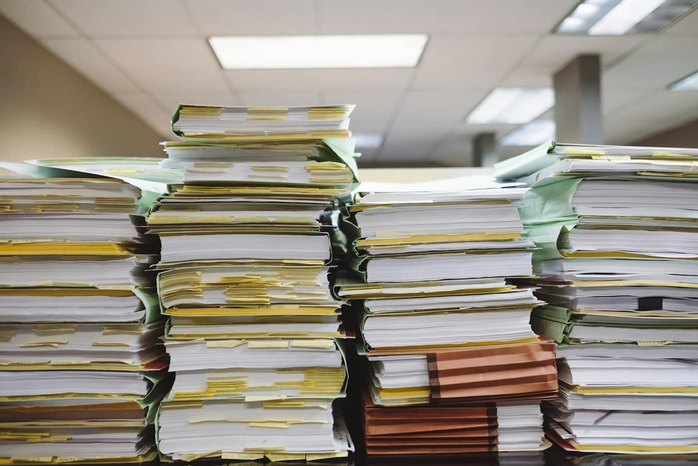 A purchase order and invoice documents on a desk