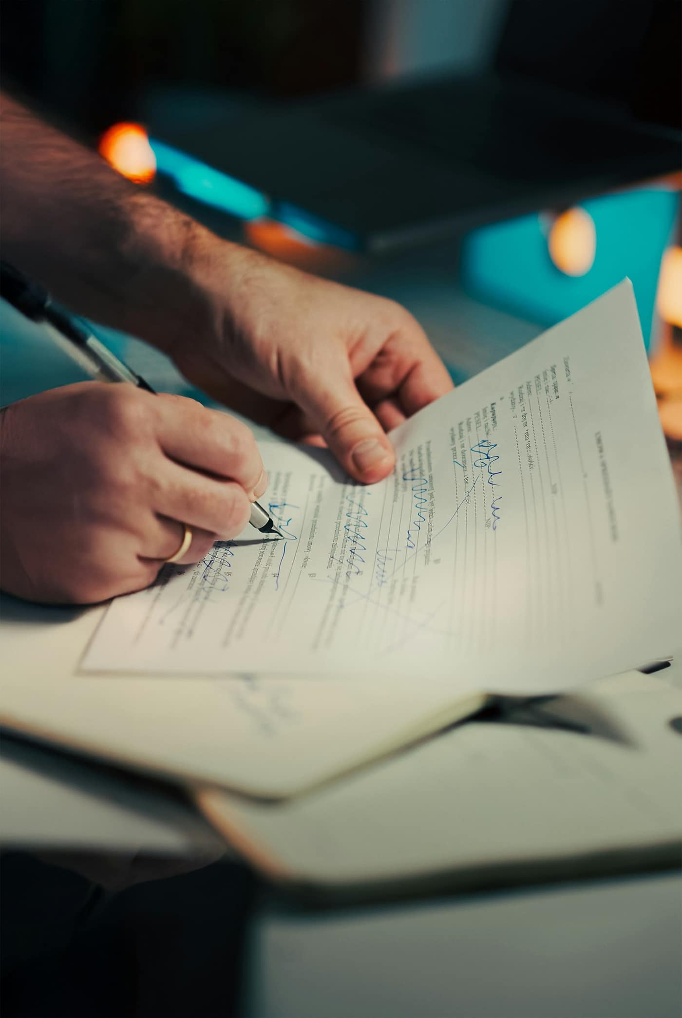 A contract being signed to confirm a deposit
