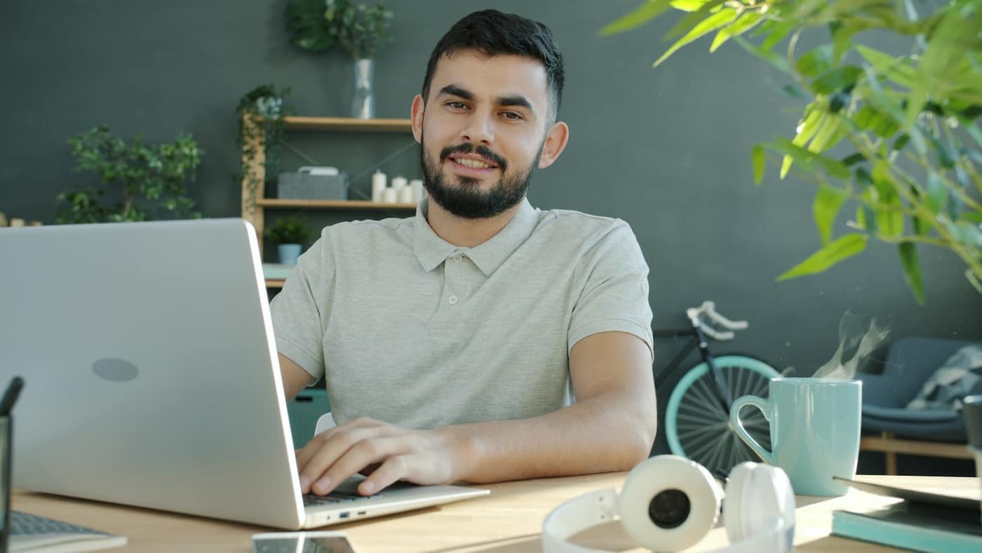 A sole trader working on a laptop