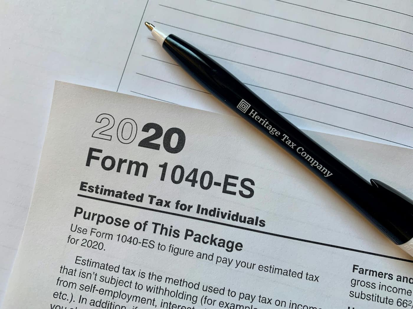 A tax form and pen on a desk