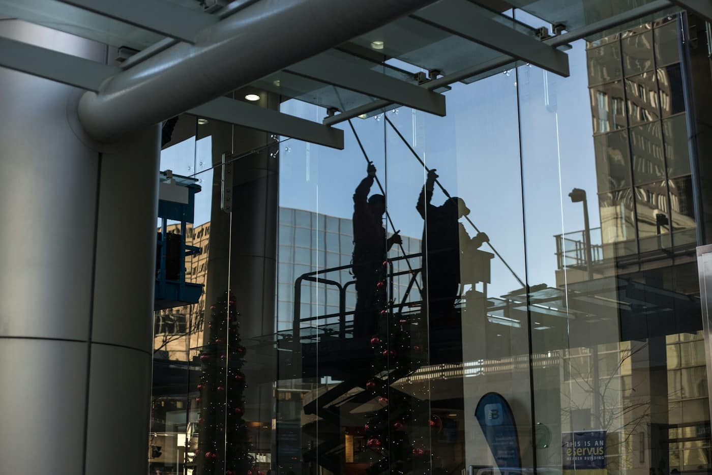 A window cleaner working on a building