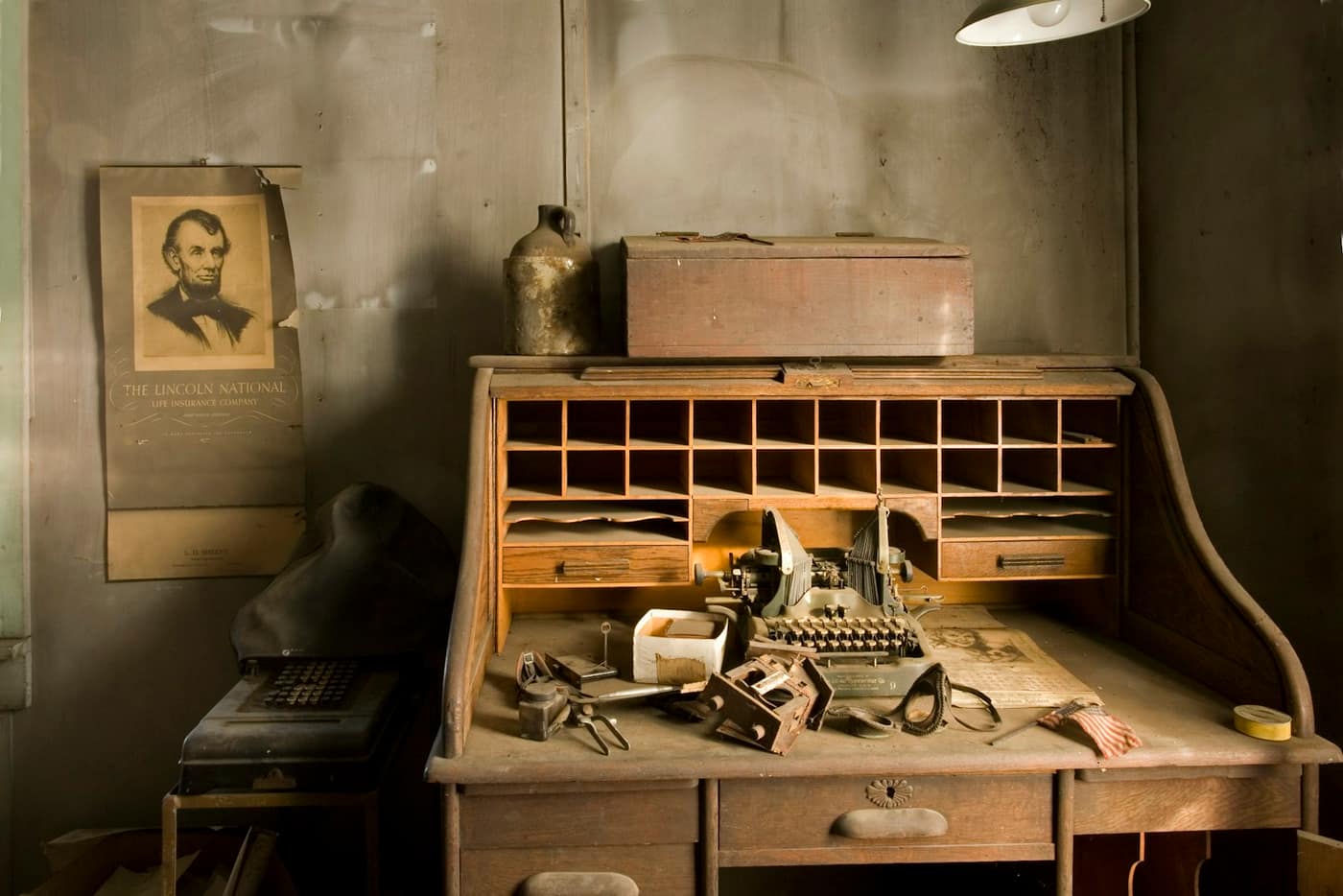 A typewriter on a wooden desk